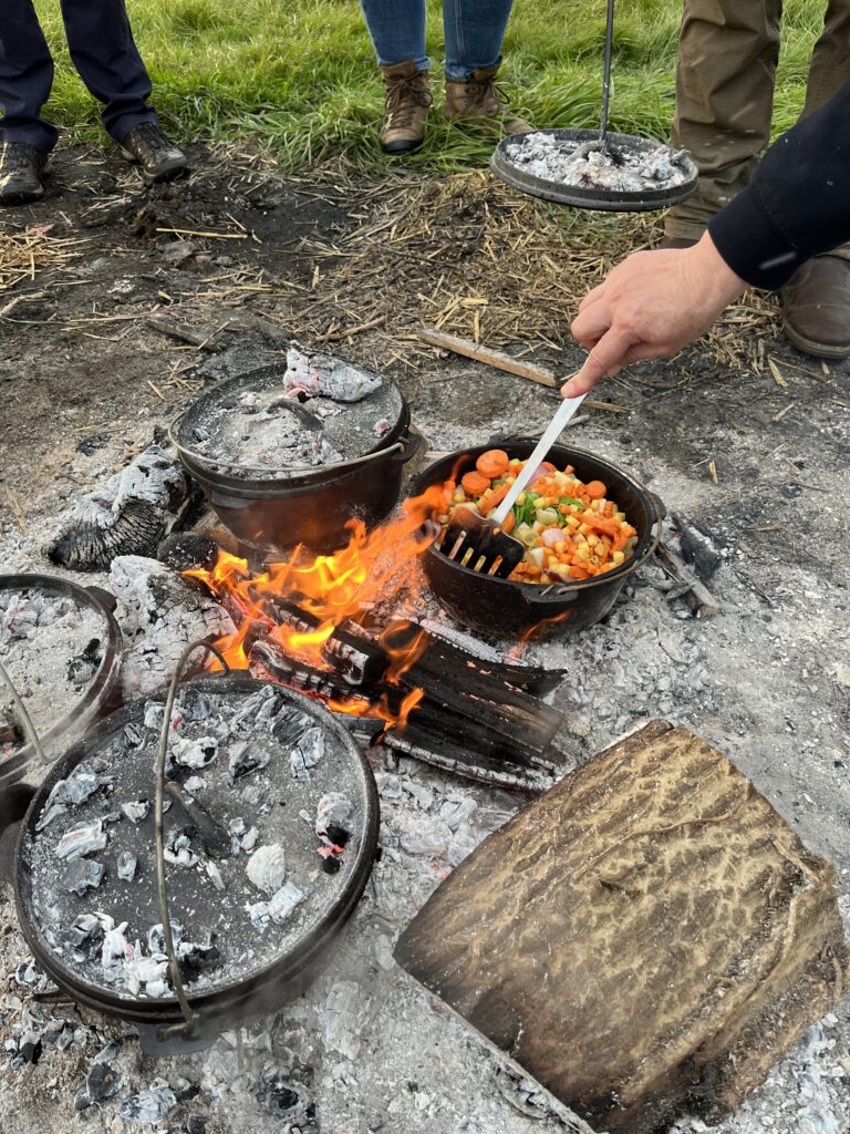 Dutch ovens on a fire pit
